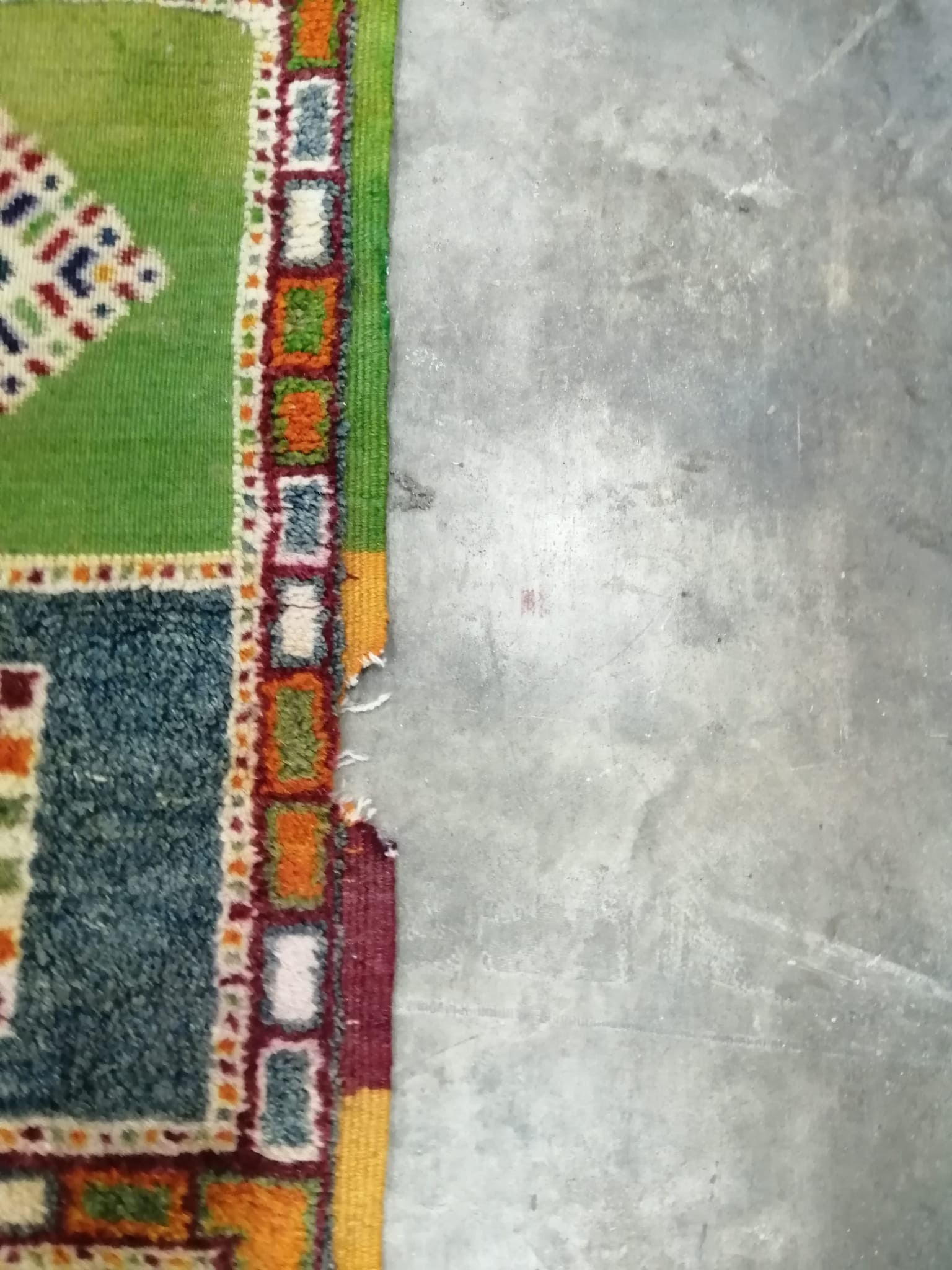 A Caucasian style wool carpet, woven with polychrome geometric squares, 430 x 260cm